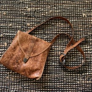 Vintage leather bag with long strap metal details